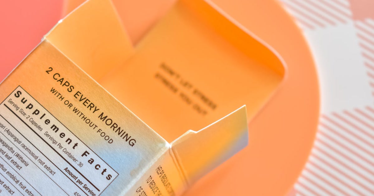 Hand holding a phone scanning a packaged food ingredient label with the NoJunk app